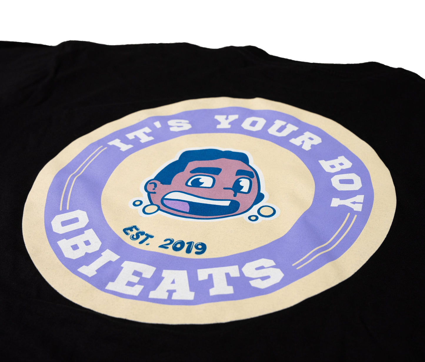 Black t-shirt with an It's Your Boy Obieats logo on a white background
